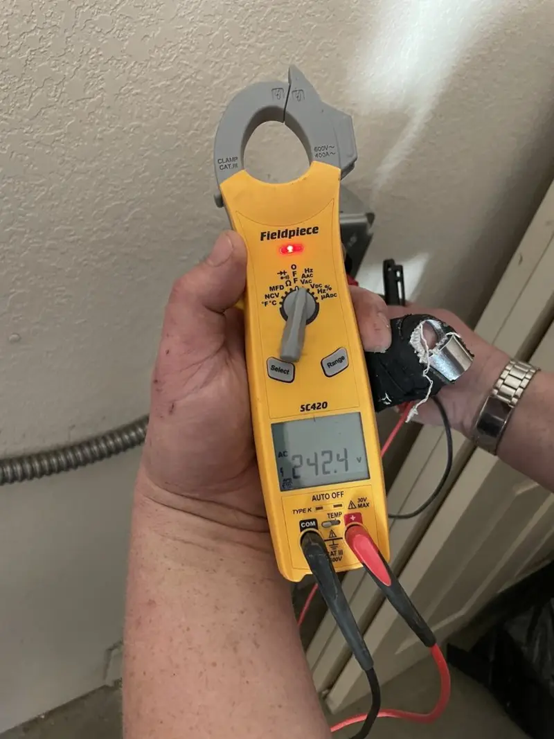 Voltage testing with clamp meter during Generator Installation in Chicago